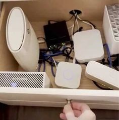 Hide modems, routers and smart home hubs in a bottom desk drawer or filing cabinet. Under Desk Storage Ideas, Desk Storage Ideas, Sleek Office, Mini Cooler, Cable Storage, Desk Drawer, Under Desk, Modems