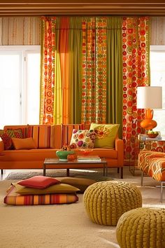 a living room filled with furniture and colorful curtains