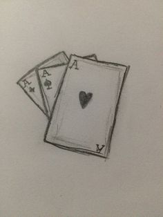 two playing cards with a heart drawn on them