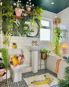 a bathroom decorated with plants and potted plants