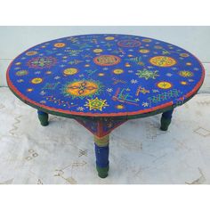 a blue table with colorful designs on it