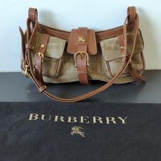 Questions? Leave A Comment Below! Brown Monogram Canvas Bucket Bag With Detachable Strap, Brown Bucket-shaped Travel Bag, Brown Bucket Bag With Zipper Closure For On-the-go, Burberry Pocket Bag, Burberry Shoulder Bag Mytheresa.com, Digital Closet, Check Fabric, Burberry Bag, Brown Beige