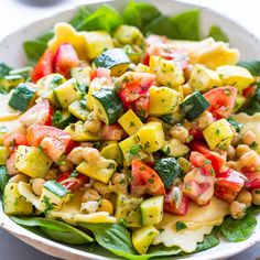 a white bowl filled with salad on top of a table