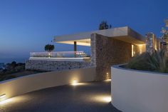 an outdoor area with lights and plants