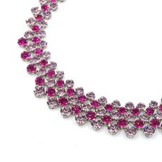 Beautiful German rhinestone collar necklace. This piece is an example of exceptionally well made costume jewelry. Pale pinkish lilac with the pop of saturated fuchsia. The adjustable length makes it very versatile. Marked "Made in Germany" which likely dates the piece to before 1949. In very good vintage condition with minimal signs of age. Length adjusts from 14" to 17" Long 1" Tall in front) Weighs: 59.9 grams Please feel free to contact me with questions and/or for additional photos. More rhinestones pieces in the shop: Teal & green Weiss necklace - https://basefare.etsy.com/listing/1756719009 Satin glass rhinestone necklace - https://basefare.etsy.com/listing/1744972433 Emerald green dangle earrings - www.etsy.com/BaseFare/listing/1459628106 *Free Domestic Shipping on Orders Over $35* Pink Crystal Rhinestone Necklace In Glamorous Style, Pink Crystal Glamorous Necklace, Glamorous Pink Crystal Necklace, Pink Rhinestone Jeweled Necklace For Parties, Pink Crystal Rhinestone Necklace With Sparkling Stones, Elegant Pink Rhinestone Necklace With Sparkling Stones, Glamorous Pink Rhinestone Necklace, Pink Crystal Necklace With Rhinestones, Dazzling Pink Necklaces With Sparkling Stones