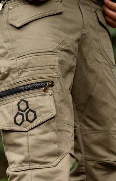 The Psy Cargo Trousers are perfect for all occasions! Featuring 6 front pockets, 4 side cargo pockets, 2 back pockets, 1 waterproof pocket with waterproof closing zip and one 1 secret pocket. Also featuring a metal buckle. The geometric and lotus designs on the pockets are subtle yet distinct in style. These pants are perfect for festivals or just getting around hands-free in comfort and with convenience! Sizes (inches) S = 30-32 M = 32-34 L = 34-36 XL = 36-38 MEASUREMENTS: S: Top of waistband: Practical Cargo Pants With Multiple Pockets For Outdoor, Practical Cargo Pants With Side Pockets For Outdoor, Practical Outdoor Cargo Pants With Side Pockets, Techwear Cargo Pants With Belt Loops For Hiking, Functional Cargo Pants For Hiking With Belt Loops, Utility Cargo Pants With Belt Loops For Hiking, Practical Outdoor Pants With Side Pockets, Functional Cargo Pants With Belt Loops For Outdoor, Functional Outdoor Bottoms With Zipper Pocket