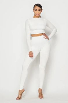 Long Sleeve Crop Top Matching Leggings Double Layered/Lined, Stretchy Material. A refined addition to any wardrobe, this set pairs sublime comfort with timeless style for a look that will take you from casual lounging to elegant evenings with ease. Material: 95% Viscose 5% Spandex Elegant Fitted Loungewear Sets, Fitted Solid Color Sets For Night Out, White Fitted Two-piece Tops Set, Fitted White Two-piece Top Set, Elegant Two-piece Loungewear Set, White Stretch Two-piece Set, White Stretch Sets With Long Sleeves, Chic Stretch Sets For Loungewear, White Stretch Long Sleeve Set