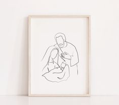 a black and white drawing of a man holding a baby