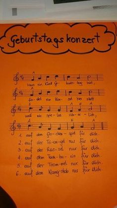 an orange sheet with music notes on it