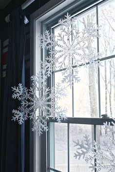 a snowflake hanging from the side of a window