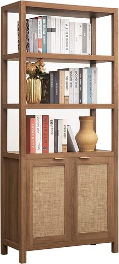 a bookshelf filled with lots of books next to a vase