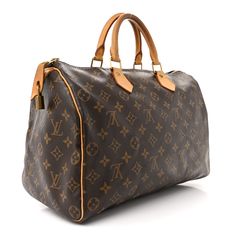 This is an authentic LOUIS VUITTON Monogram Speedy 35. This classic handbag is finely crafted of traditional Louis Vuitton monogram toile coated canvas. The bag features vachetta cowhide rolled leather top handles and trim, with polished brass hardware. The top zipper opens to a cocoa brown fabric interior with a hanging pocket. Speedy 35, Classic Handbags, Cocoa Brown, Brown Fabric, Brass Hardware, Polished Brass, Leather Top, Authentic Louis Vuitton, Louis Vuitton Monogram