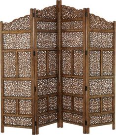 an ornate wooden screen with intricate carvings on the top and bottom panel, set against a white background