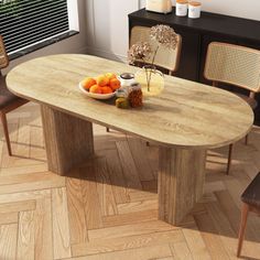 a wooden table with chairs around it and fruit on the plate in front of it