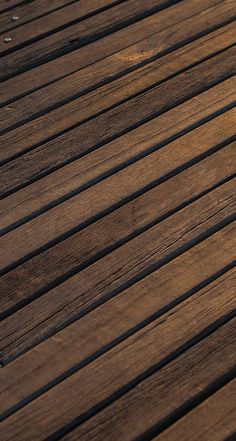 an orange sitting on top of a wooden table