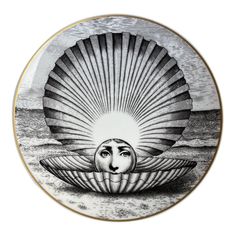 a plate with an image of a woman's face in the middle of it