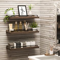 the bathroom is decorated in rustic style with white and wood accents, including two floating shelves