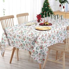 a dining table with christmas decorations on it