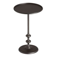 a metal table with a black top and two small round bases on each side,