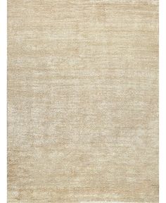 a beige rug with an uneven design