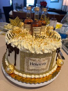 a cake decorated with bottles of hennesy syrup