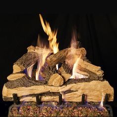 a fire place with logs burning in it