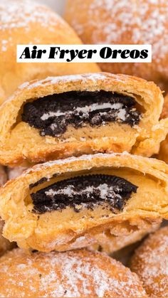 powdered sugar filled pastries stacked on top of each other with chocolate filling in the middle