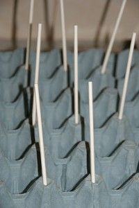 several toothpicks are sticking out of the holes in some blue fabric baggies