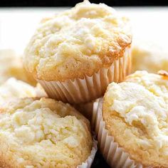 a pile of white muffins sitting on top of each other