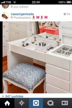 an image of a vanity with drawers and stools in the middle, on a tabletop