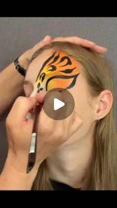 Tiger Eye Face Paint, Face Painting Design Board, Bobcat Face Paint, How To Paint A Tiger Face, Cheetah Face Paint Kids Easy, Face Painting Ideas Animals, Tiger Face Paint Easy Step By Step, Kids Tiger Face Paint, One Eye Face Paint Designs