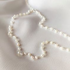 "Delicate Pearl Rosary Necklace. Looking for: - a Stunning Wedding Necklace - a Simple and Attractive necklace that can be worn on so many occasions - a Lovely touch to your day to day style Whatever the reason may be, this pearl necklace is perfect for every occasion. This pearl necklace is the PERFECT GIFT for every Woman. So delicate and feminine. We use only HIGH QUALITY materials and offer guarantee on our necklaces. We are a 5-Star Seller. Check our reviews and see what our customers say a