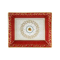 a red and white plate with gold trim