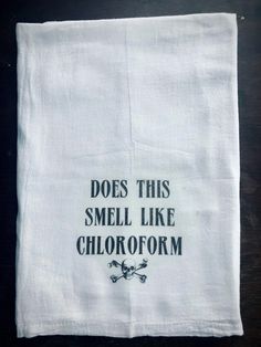 a tea towel with the words does this smell like chlorofm on it