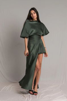 The Fiore Dress is an asymmetrical dark sage green silk dress, with a cowl neckline and ruched waist detailing. It means business on the right side and party on the left. It takes us 15 hours to make this dress. Sustainable Dress, Dark Sage Green, Satin Silk Dress, Green Silk Dresses, Dark Sage, Silk Cocktail Dress, Olive Green Dresses, Bespoke Fashion, Cowl Neck Dress