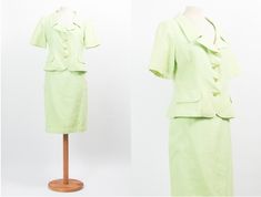 This is a lovely Sixties vintage skirt suit. The top is buttoned up in the front, fake pockets, short sleeves. The shirt is zipped. Cotton fabric, lime green main color with white small dots; buttons are golden color. ✂ MEASUREMENTS ✂ Skirt: waist: 37 cm 16.7 in hips: 52 cm 20.5 in bottom width: 58 cm 22.8 in total length: 62 cm 24.4 in Jacket: shoulders: 41 cm 16.1 in bust: 50 cm 19.7 in sleeve: 26 cm 10.2 in bottom width: 52 cm 20.5 in total length: 49 cm 19.3 in Size: n/a tailored Best fit: M Spring Short Sleeve Sets With Buttons, Green Short Sleeve Sets With Buttons, Spring Short Sleeve Office Sets, Spring Office Sets With Short Sleeves, Fitted Vintage Sets With Buttons, Spring Short Sleeve Skirt Suit For Work, Classic Short Sleeve Sets For Spring, Vintage Formal Summer Sets, Vintage Formal Sets For Summer