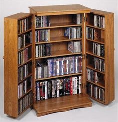 a wooden bookcase filled with lots of dvd's