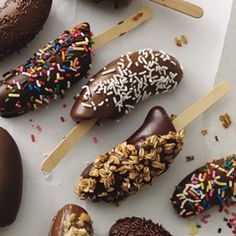 chocolate covered donuts and ice cream on sticks with sprinkles