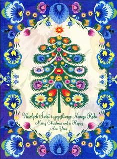 a blue and white christmas card with a tree in the center, surrounded by flowers