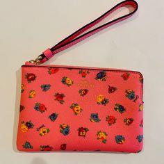 Coach Corner Zip Wristlet/ Mini Vintage Rose Print/Pink/Multi Leather New With Tags Printed Coated Canvas And Smooth Leather Two Credit Card Slots Zip-Top Closure, Fabric Lining Wrist Strap Attached 6 1/4" (L) X 4" (H) X 1/2" (W) Style No. Ca716 Gold Foil Logo Gold-Tone Hardware Wrist Strap: 7" In Length Msrp $78.00 Imported Trendy Pink Rectangular Wristlet, Pink Wallet With Wrist Strap As Gift, Pink Clutch Wristlet As A Gift, Pink Pouch Wristlet With Wrist Strap, Pink Pouch Wristlet With Strap, Pink Spring Wristlet, Trendy Pink Wristlet For Spring, Trendy Pink Wristlet With Wrist Strap, Pink Clutch Wristlet