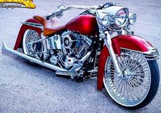 a red and white motorcycle parked on the street