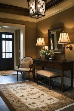 a foyer with two lamps, a bench and a mirror on the wall above it