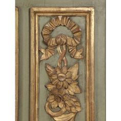 an ornate gold frame with flowers on it