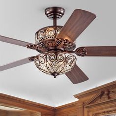 a ceiling fan that is hanging from the ceiling