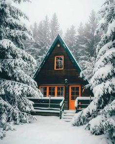 a cabin in the woods is surrounded by snow