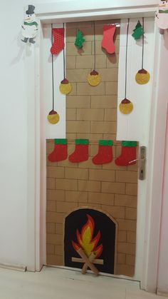 the fireplace is decorated with stockings and stockings