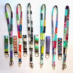 several lanyards are lined up against a white background with different patterns on them