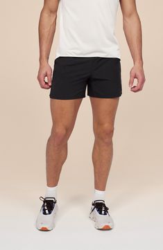 Lightweight, quick-drying fabric keeps you going for miles in running shorts with a supportive interior brief and handy pockets for keys, cash and energy gels. 5" inseam; 25" leg opening; 10 1/2" front rise; 14" back rise (size Medium) Elastic/drawstring waist Front slant pockets; side mesh pocket Interior brief 100% recycled polyester Machine wash, dry flat Imported Black Nylon Running Shorts, Running Activewear With Elastic Waistband Shorts, Short Running Activewear With Elastic Waistband, Short Activewear For Running With Elastic Waistband, Short Activewear With Elastic Waistband For Running, Bottoms With Built-in Shorts And 4-way Stretch For Errands, Casual Athletic Shorts For Running With Short Inseam, Athletic Running Shorts With Elastic 4-way Stretch, Casual Athletic Shorts With Short Inseam For Running