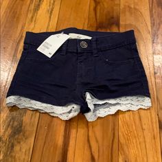 Navy Blue Shirts With Lace Appliqu Ruffle On Bottom. Nwt Blue High-waist Shorts With Ruffles, H&m Blue Jean Shorts For Summer, Blue H&m Shorts, Blue Cotton H&m Shorts, H&m Blue Cotton Shorts, H&m Shorts, Navy Blue Shirts, Blue Shirt, Lace Applique