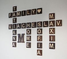 scrabble tiles are arranged in the shape of letters that spell out family and love